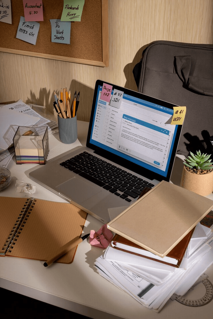 A modern workspace with a laptop and supplies